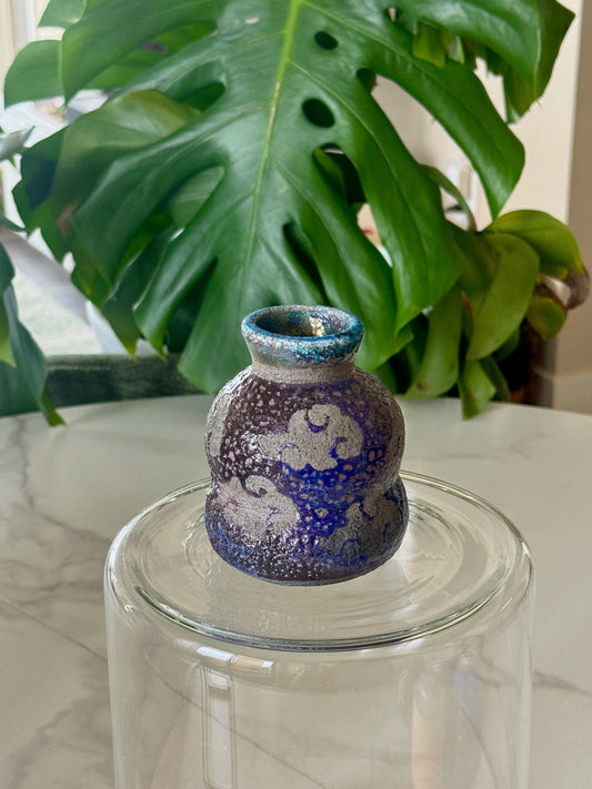 One Piece raku bud vase side view showing cloud pattern and glaze texture