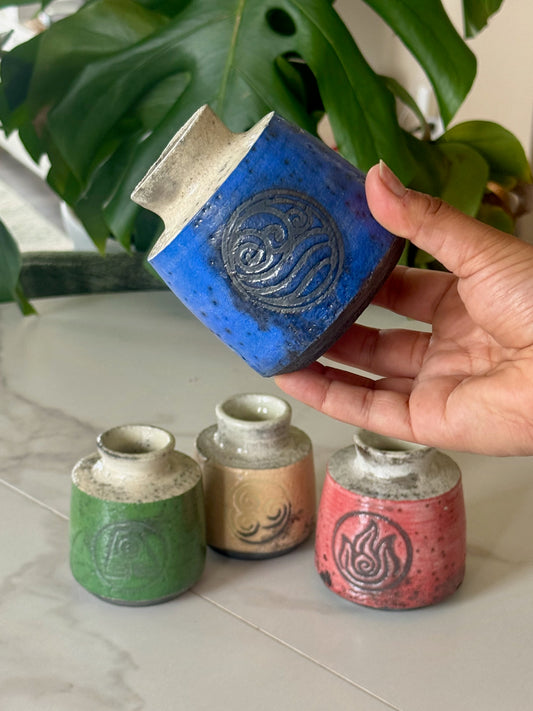 Air Nomad raku bud vase in tan with air symbol stamp