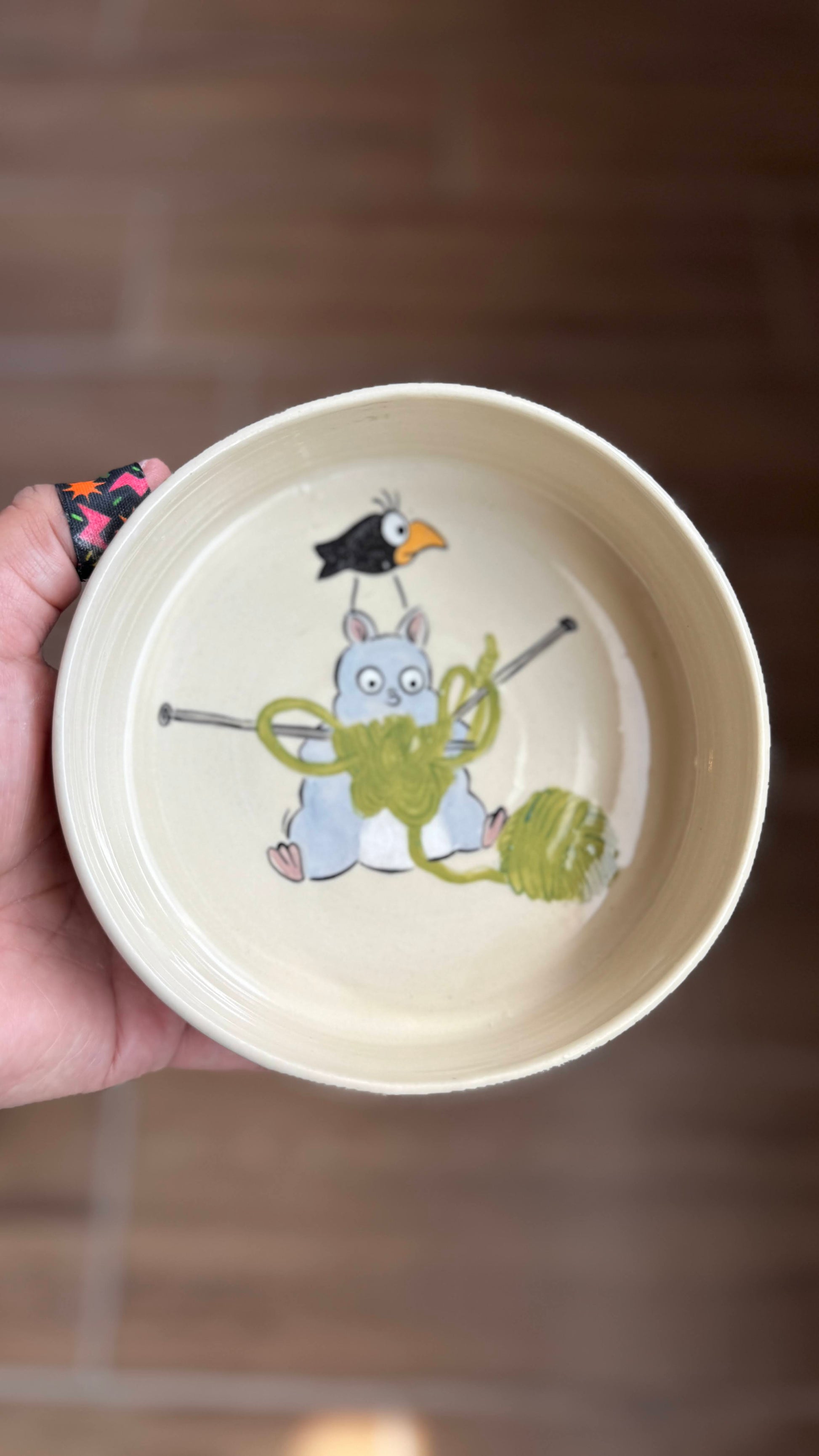 Spirited Away mouse knitting bowl showing Boh mouse tangled in yarn with crow