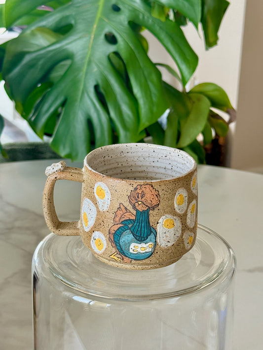 Chicken and eggs mug front view with sculpted chicken handle