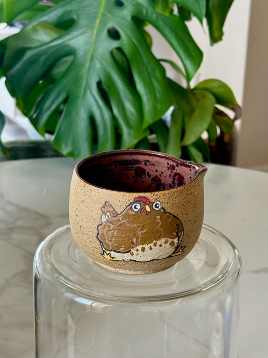 Chicken spouted bowl front view showing hand-illustrated chicken design