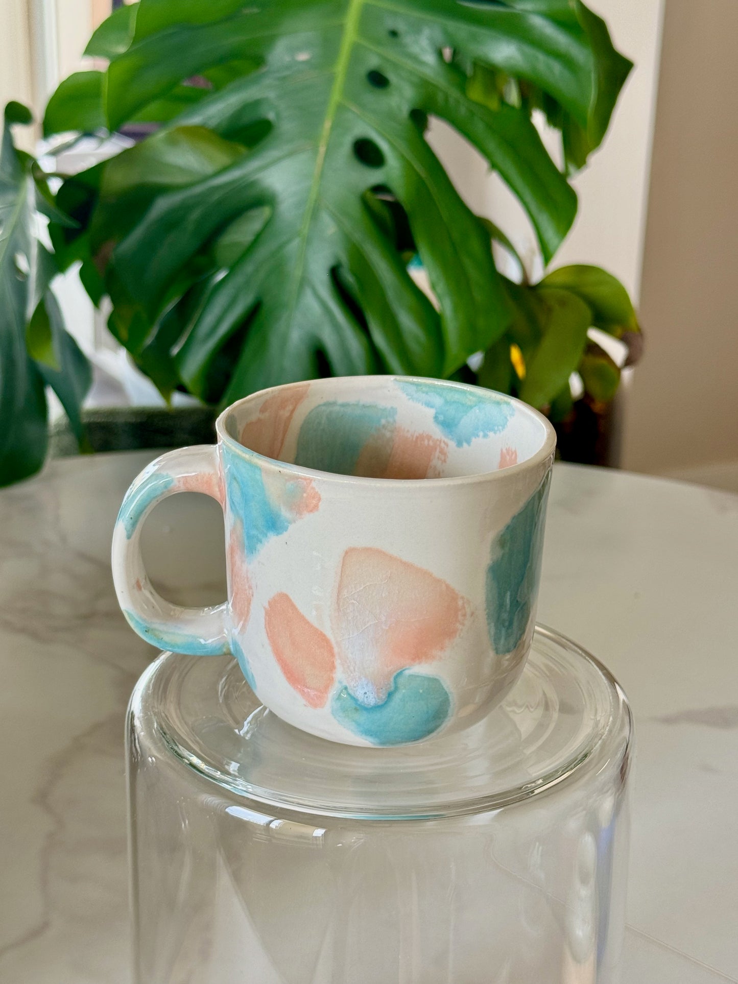 Abstract dot cappuccino mug front view