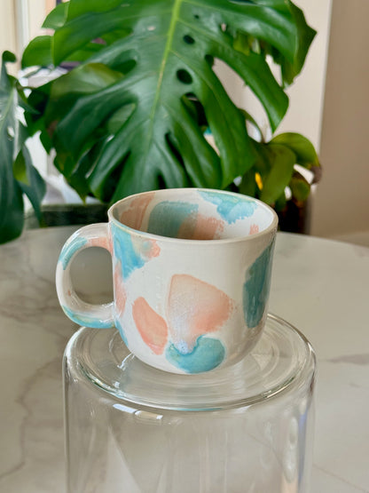 Abstract dot cappuccino mug front view