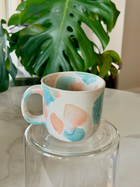 Abstract dot cappuccino mug front view