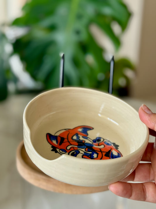 Magikarp yin-yang dish held showing depth and cream glaze interior