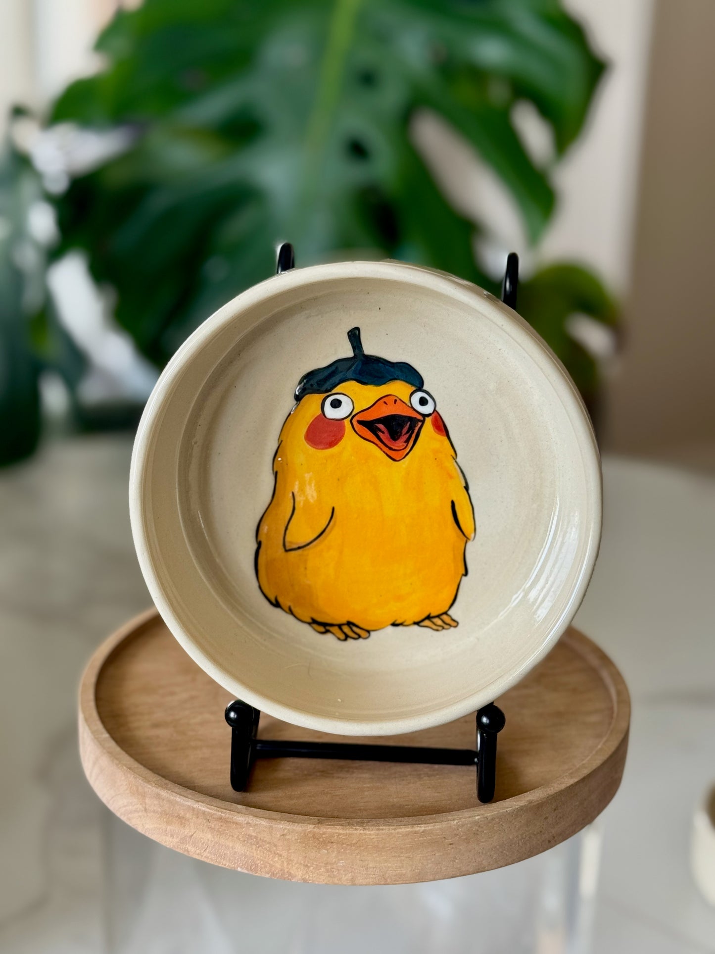 Spirited Away duck bowl showing yellow duck in beret on cream glaze