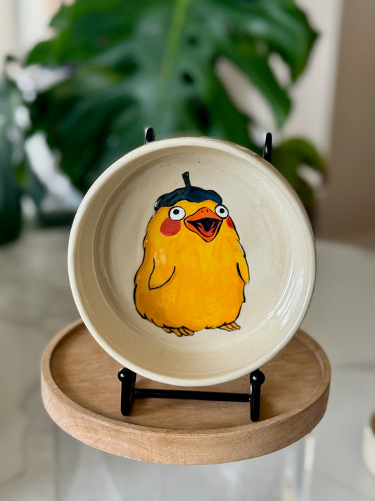 Spirited Away duck bowl showing yellow duck in beret on cream glaze