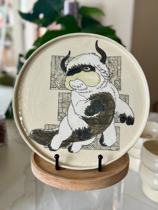 Appa plate front view showing Appa with Air Nomad mandala border on cream glaze