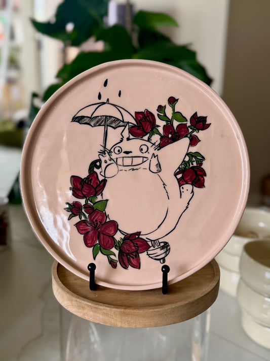 Totoro decorative plate with deep red floral wreath border on blush pink glaze