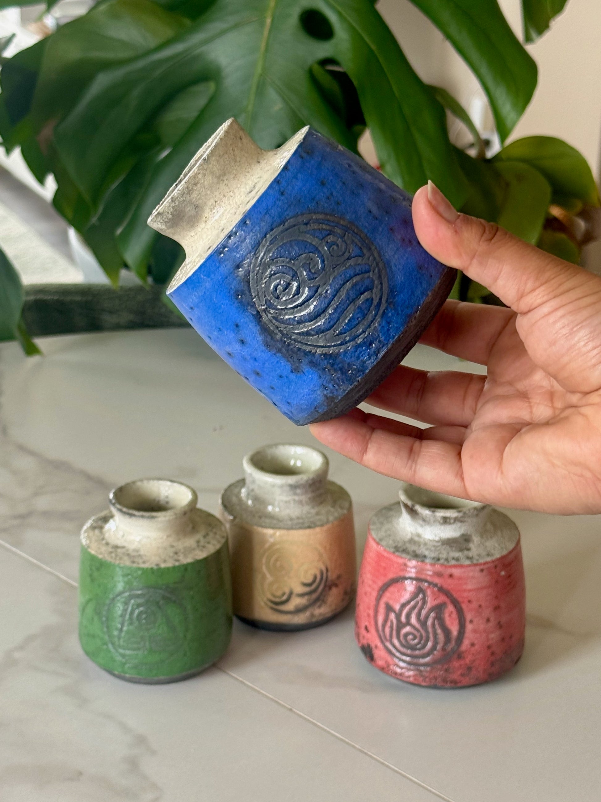 Air Nomad raku bud vase in tan with air symbol stamp