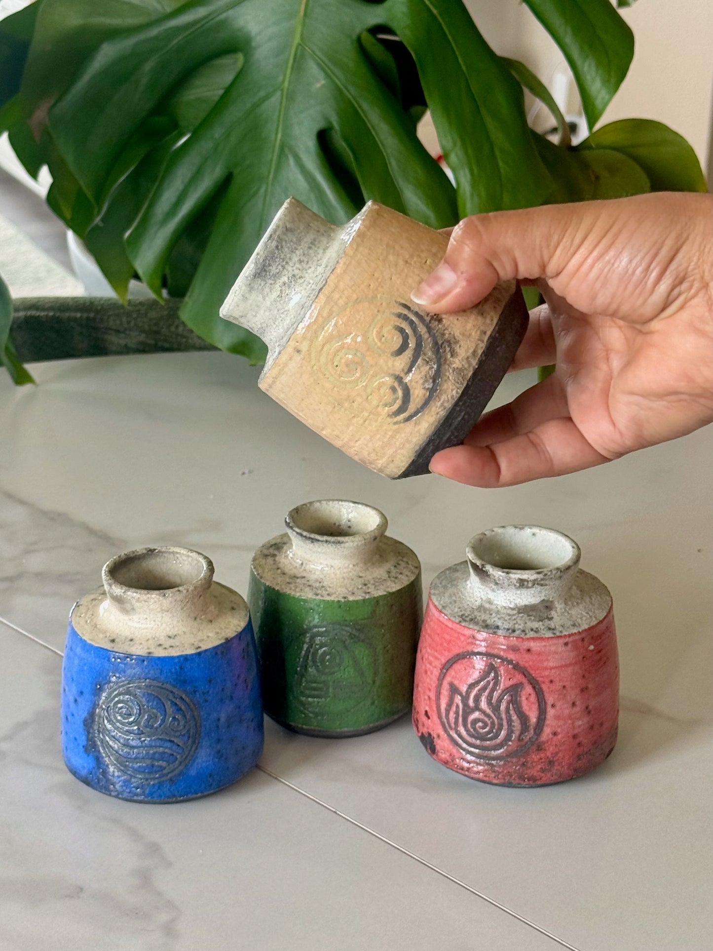 Fire Nation raku bud vase in deep red with fire symbol stamp