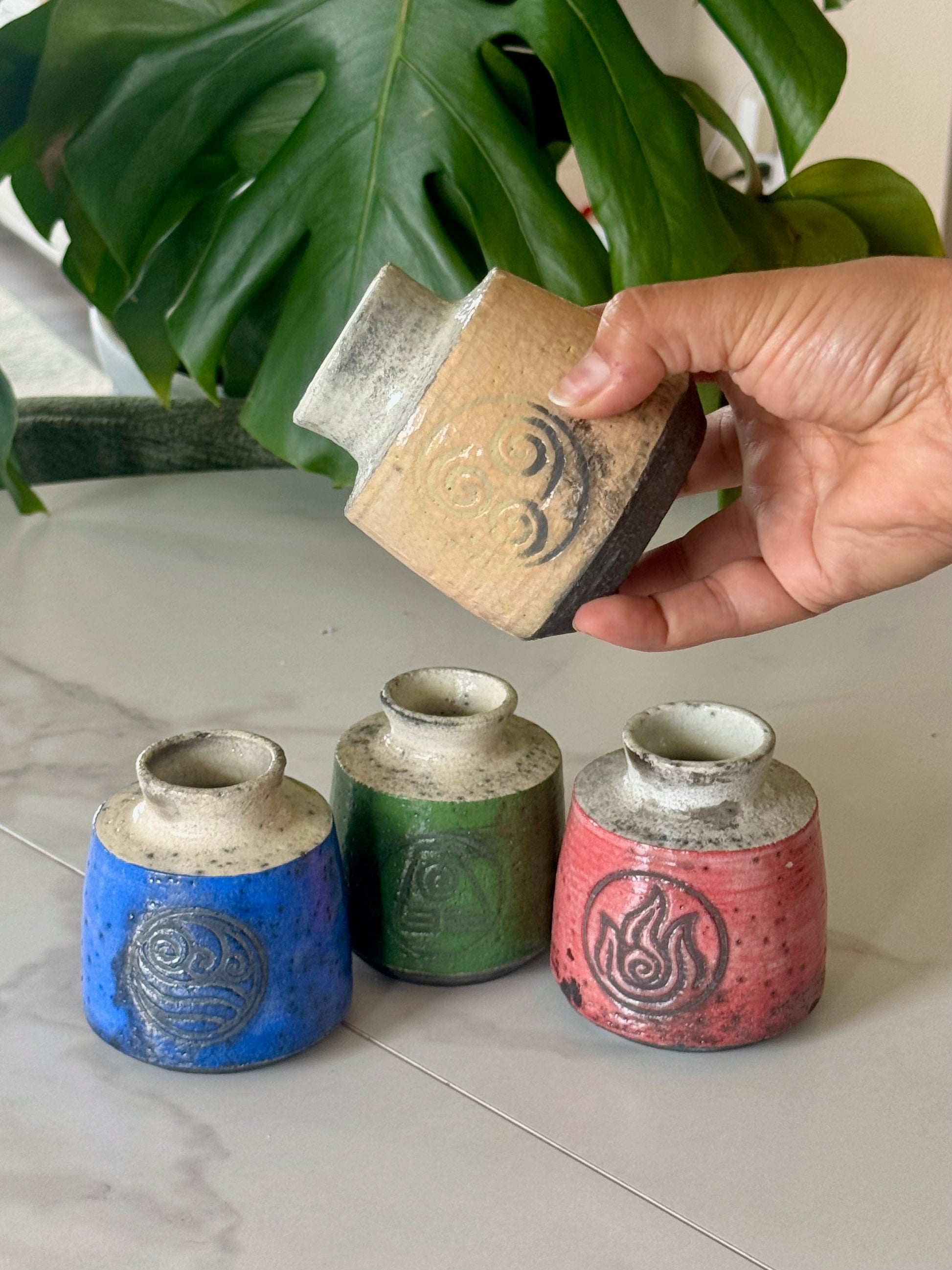Fire Nation raku bud vase in deep red with fire symbol stamp