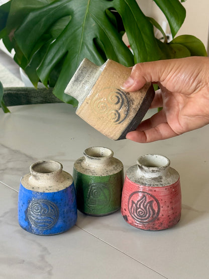 Fire Nation raku bud vase in deep red with fire symbol stamp