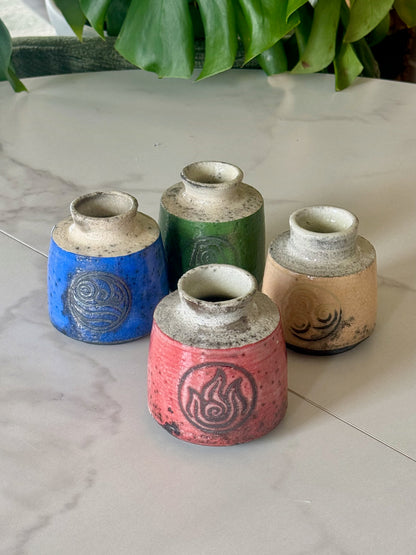 Earth Kingdom raku bud vase in forest green with earth symbol stamp