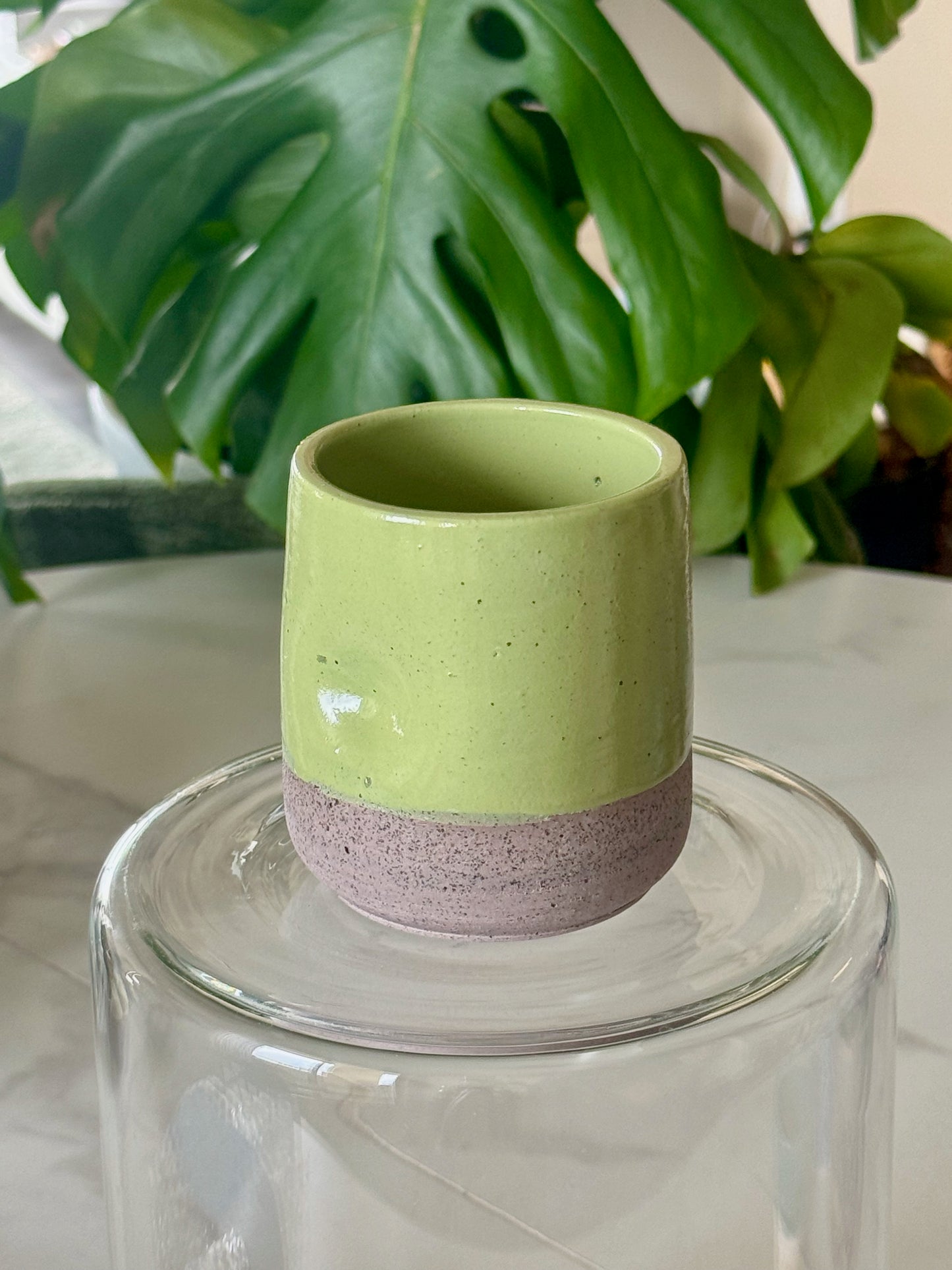 Teal ocean drip glaze thumb cup with lavender speckled base