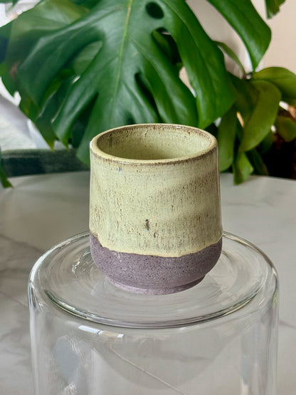 Periwinkle blue thumb cup with brown speckled base