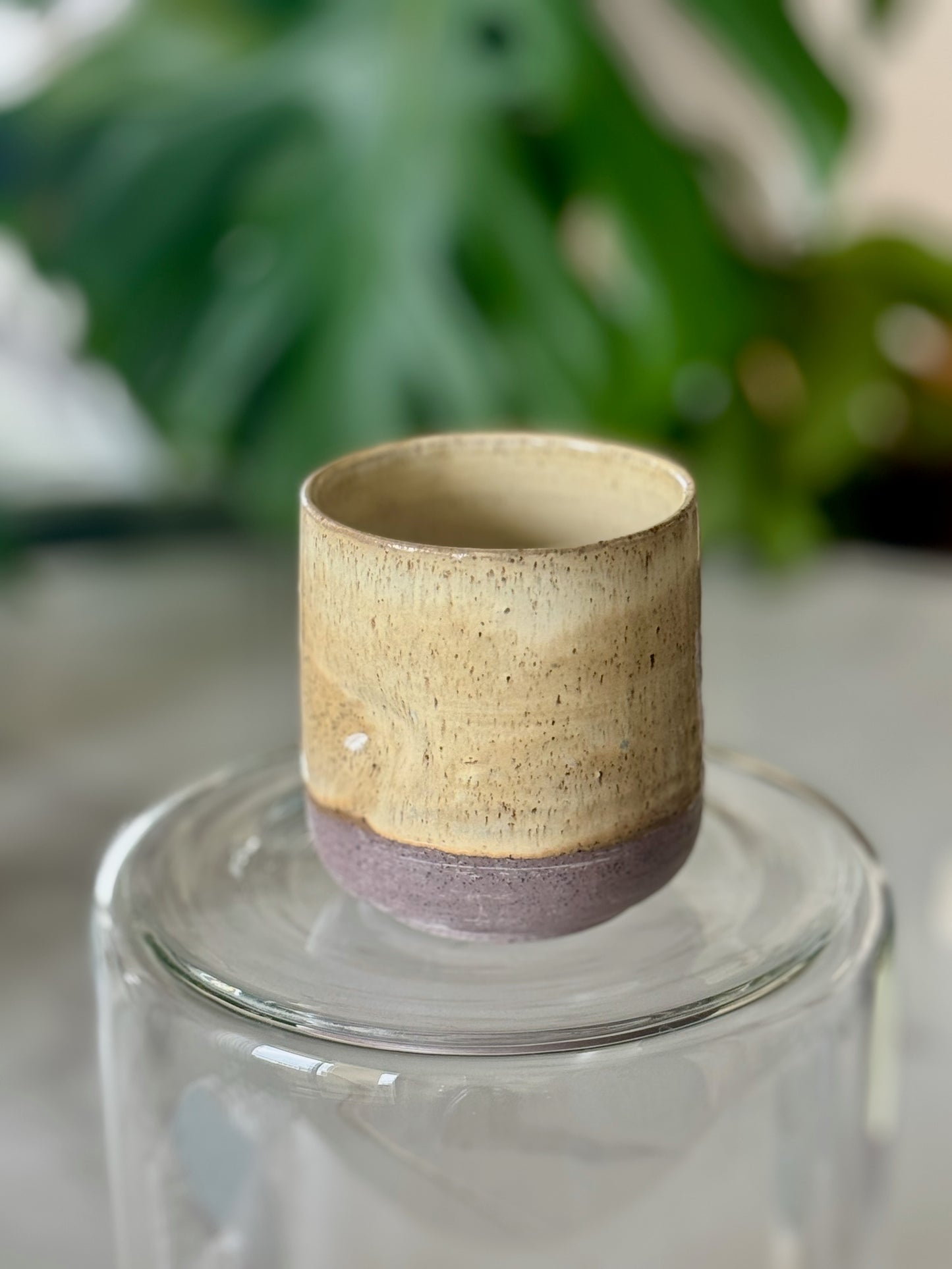 Thumb cup detail shot showing glaze texture and unglazed base