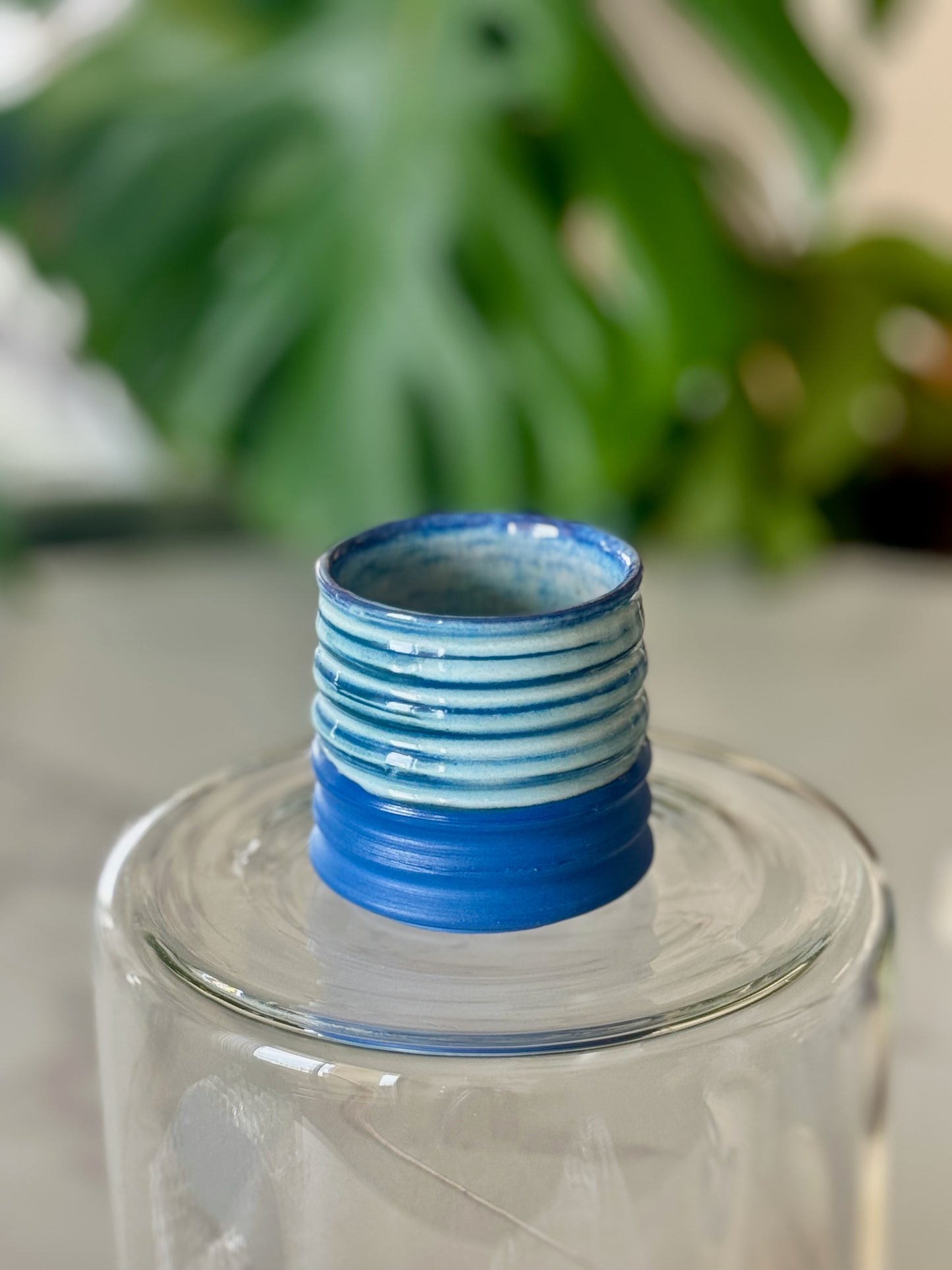 Mini ribbed espresso cup front view showing cobalt blue matte exterior with horizontal ribbing