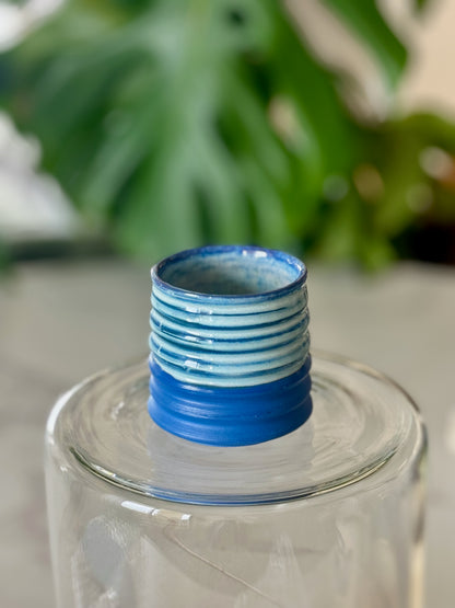 Mini ribbed espresso cup front view showing cobalt blue matte exterior with horizontal ribbing