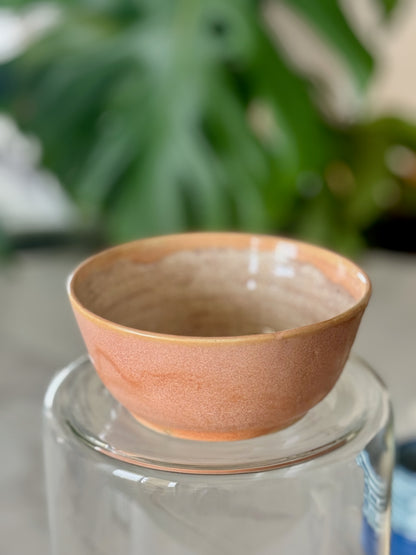 Spiral glaze bowl front view showing warm peach glaze exterior