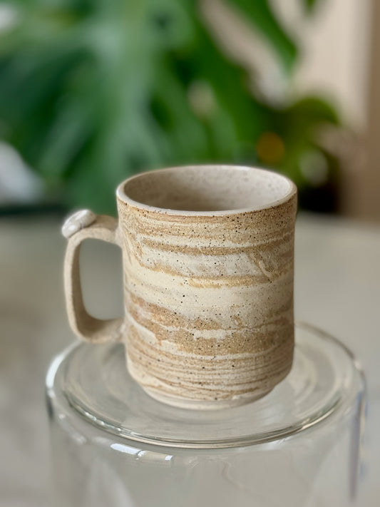 Marbled clay mug front view showing loop handle with ball detail and marbled texture