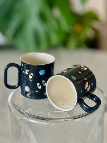 Two soot sprite espresso mugs showing white unglazed interior and bottom