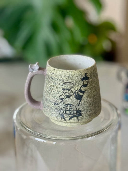 Stormtrooper mug front view showing hand-illustrated Stormtrooper with coffee cup on speckled clay