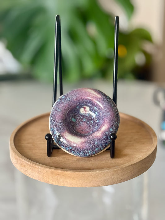 Galaxy glaze ashtray showing swirling purple, teal, and pink glaze with deep pooled center